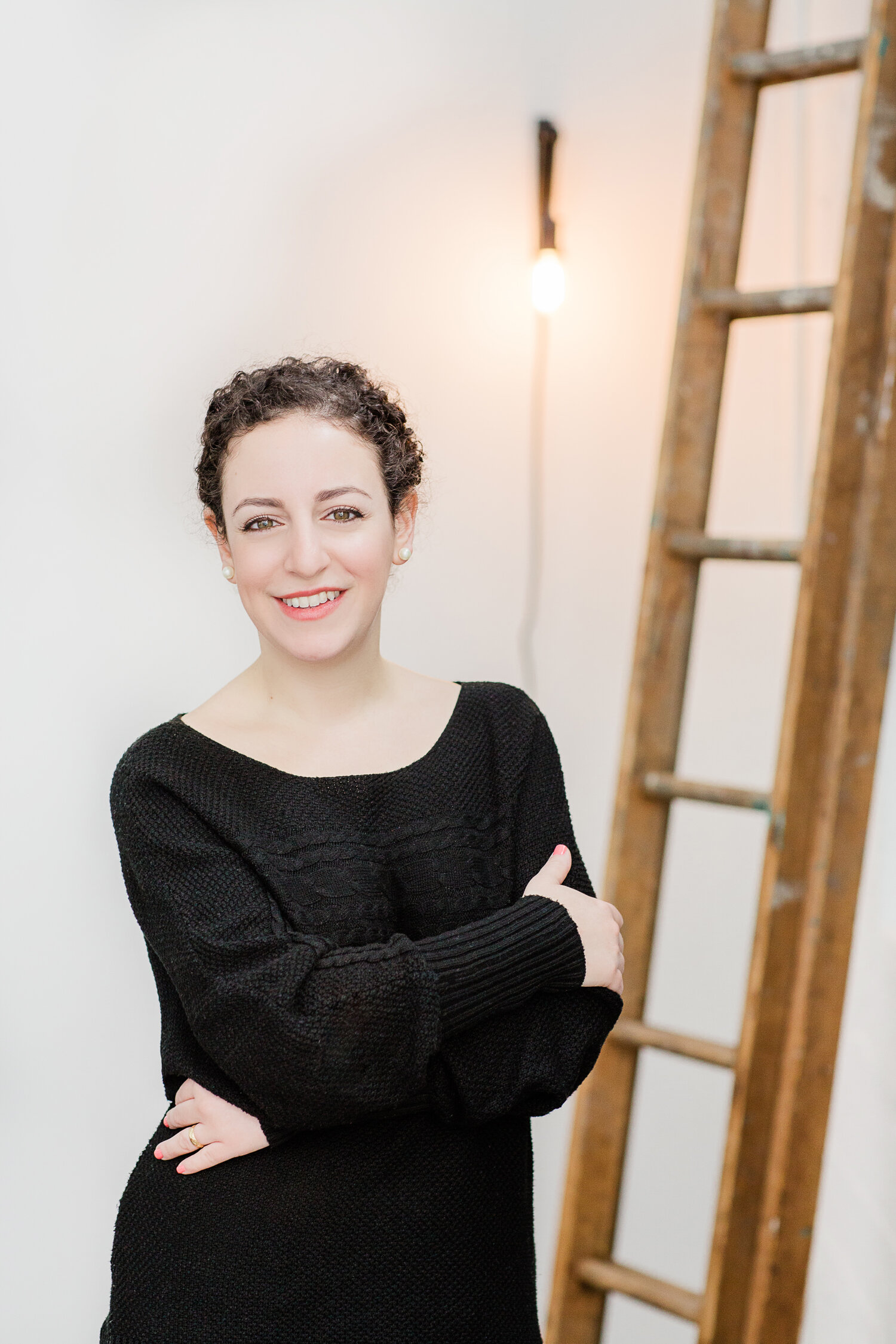 Young professional woman smiling at business event.