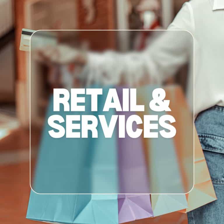 Shopping bags with retail and service options at Clarington Board of Trade event.