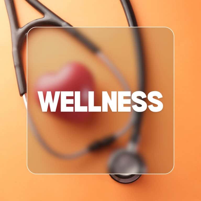 Alt text: Close-up of stethoscope with heart-shaped tip on orange surface.