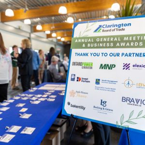 Signboard displaying Clarington Board of Trade's annual meeting and business awards with partner logos.