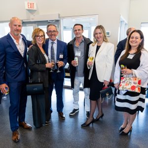 Business professionals networking at Clarington Board of Trade event, high-quality corporate event photo.