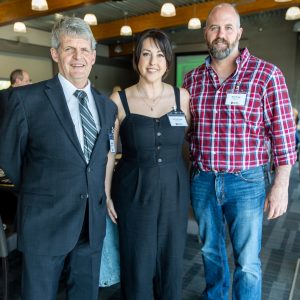 Business professionals networking at Clarington Board of Trade event in a modern conference setting.