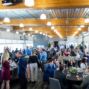 Modern event hall hosting business networking, meetings, and trade association gatherings.
