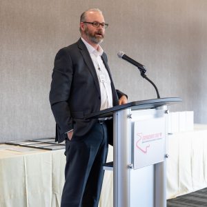 Business professional speaking at Clarington Board of Trade event.