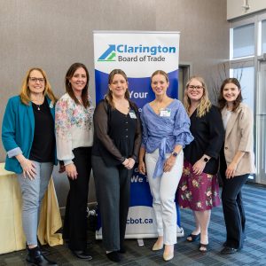 Friendly business leaders posing at Clarington Board of Trade event.