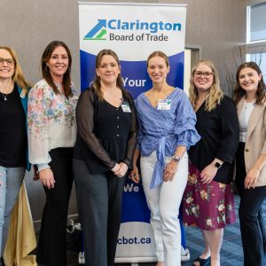 Diverse women networking at Clarington Board of Trade event in a modern venue.