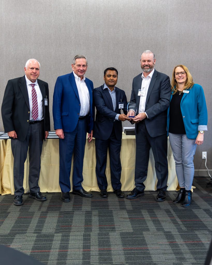 Award ceremony at Clarington Board of Trade event with business leaders.