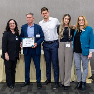 Dignitaries celebrating long-term business achievement at Clarington Board of Trade event.