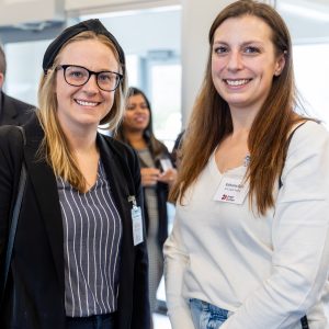 Business women smiling at Clarington Board of Trade networking event, professional women connecting.