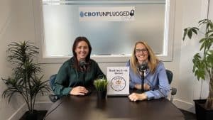 Professional women hosting business podcast at Clarington Board of Trade studio.