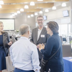 Business professionals networking at Clarington Board of Trade event.