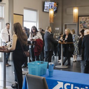 Business professionals networking at Clarington Board of Trade event.
