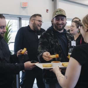 Business professionals enjoying networking at Clarington Board of Trade event.