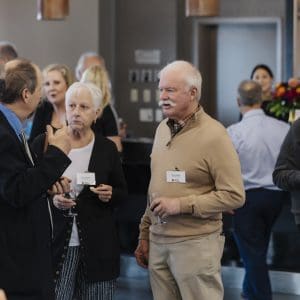 Business professionals networking at Clarington Board of Trade event.