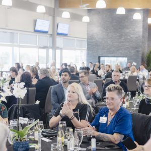 Attendees at the Clarington Board of Trade networking event in a modern conference hall.