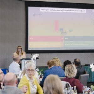 Clarington Board of Trade event with attendees and presentation screen.
