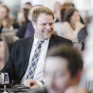 Business professionals at Clarington Board of Trade event in a conference setting.
