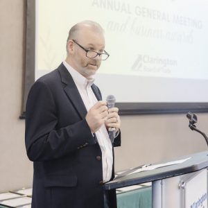 Man speaking at Clarington Board of Trade event during annual meeting.