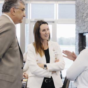 Business professionals networking at Clarington Board of Trade event.