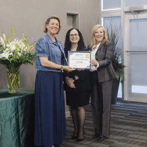 Clarington Board of Trade award presentation with three women smiling.