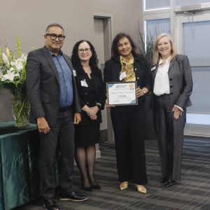Group of professionals at Clarington Board of Trade event, celebrating achievement.
