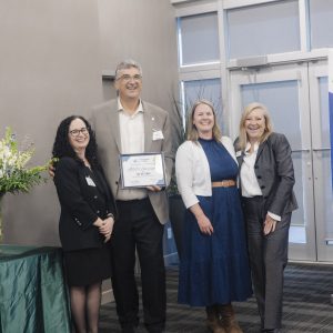 Group of professionals at Clarington Board of Trade event, celebrating business achievements.