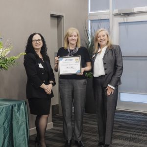 Award presentation at Clarington Board of Trade event with three professional women.