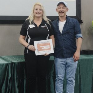 Clarington Board of Trade event with two smiling attendees holding a certificate.