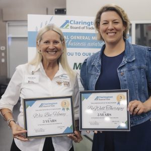 Two women holding awards at Clarington Board of Trade event.